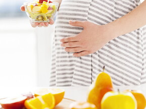 Pregnant women eating fruit salad Pregnant women eating fruit salad